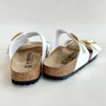 Birkenstock Sydney Cushion Buckle In Birko Flor Vernice Bianca